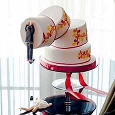 Bride & Groom Jump From Cake