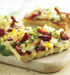 Garlicky Grilled Pizzas With Grilled Shrimp, Feta & Sun-Dried Tomatoes